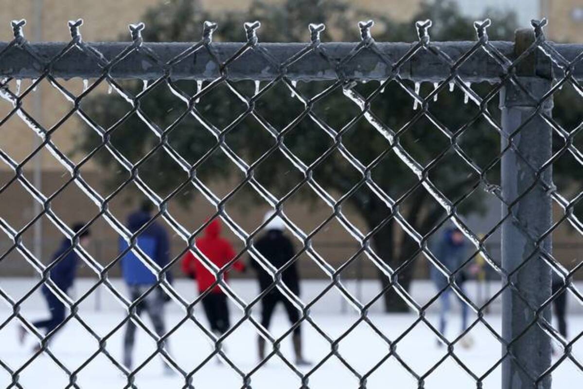 Youths play soccer in the ice and snow in Richardson, Tex., on Feb. 3. (Tony Gutierrez/AP)