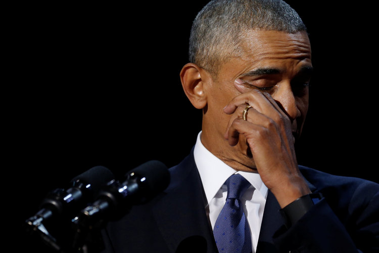 Barack Obama wipes away tears last night. (Jonathan Ernst/Reuters)</p>  