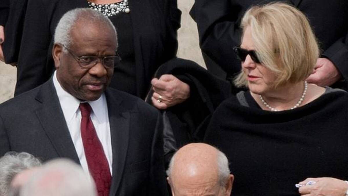 The Jan. 6 committee plans to request an interview with Virginia Thomas – seen here in a file photo with her husband, Supreme Court Justice Clarence Thomas. (Pablo Martinez Monsivais/AP Photo, File)