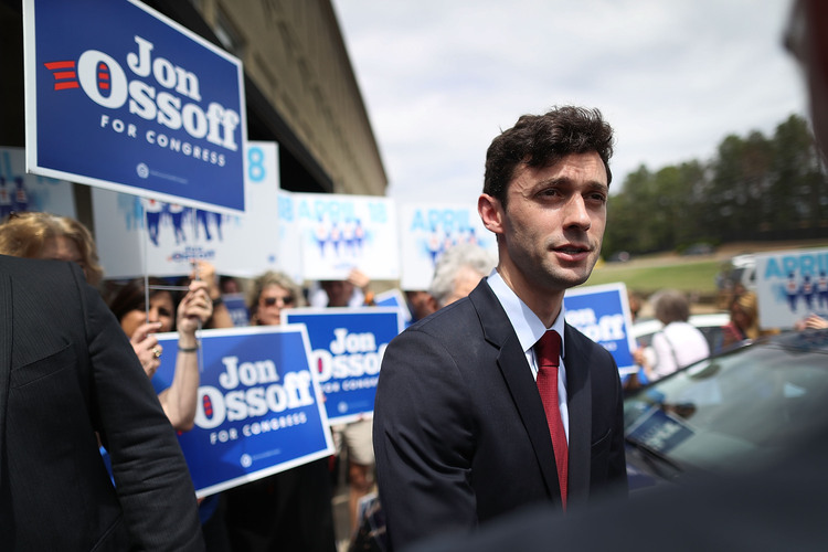 Jon Ossoff speaks to reporters during a visit to a campaign office yesterday in Marietta. (Joe Raedle/Getty Images)</p>  