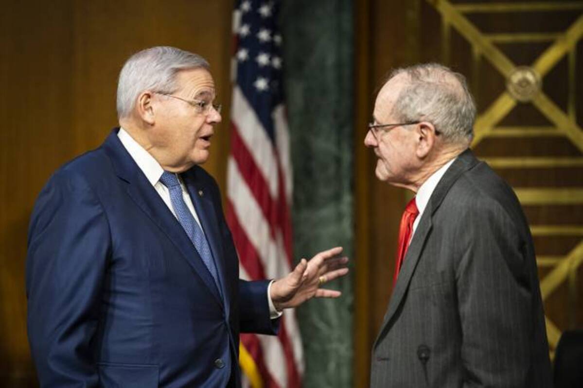 Senate Foreign Relations Committee Chairman Sen. Robert Menendez (D-N.J.) and Sen. Jim Risch (R-Idaho) speak before a hearing on Capitol Hill on Feb. 8. (Jabin Botsford/The Washington Post)