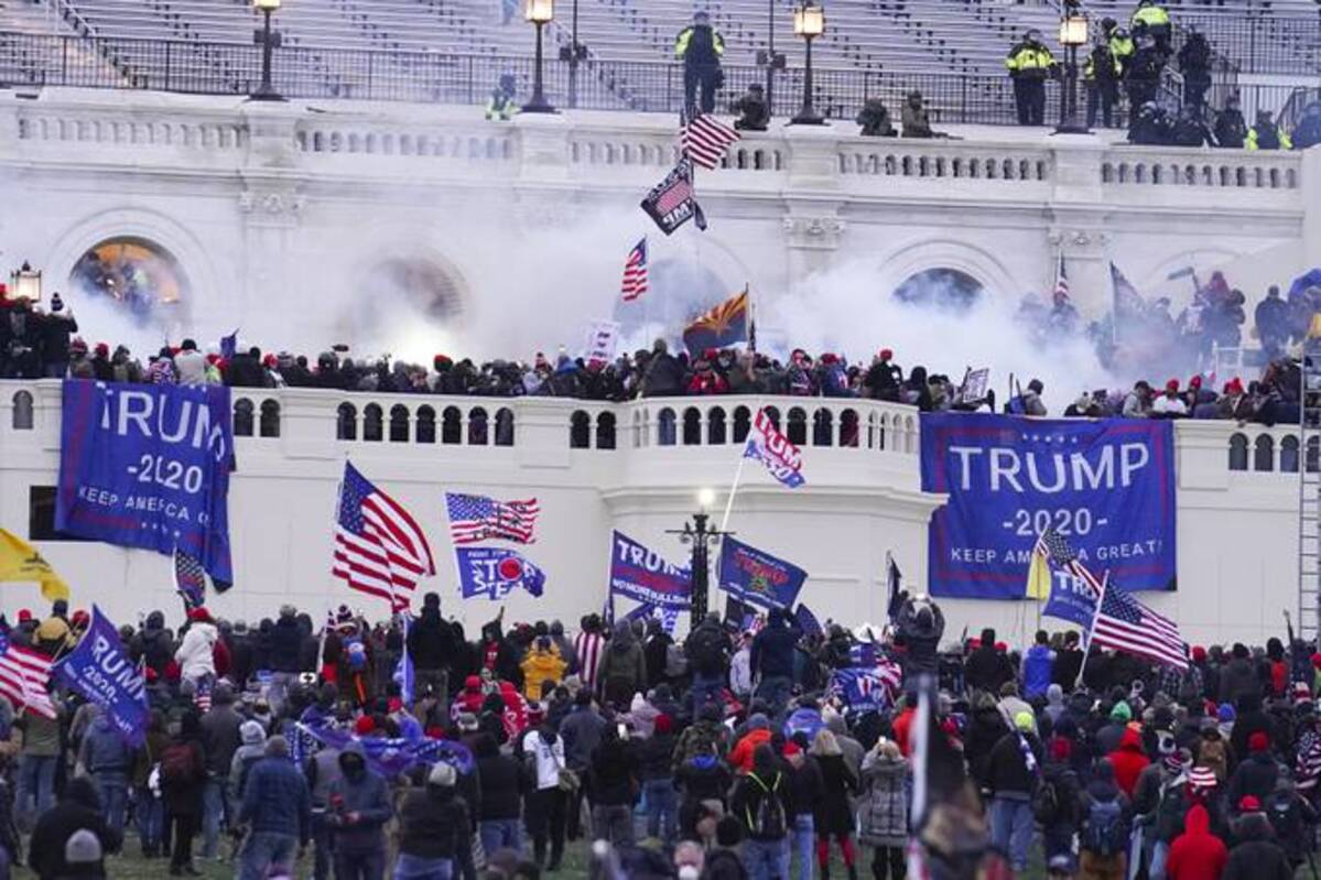 Rioters on the West Front at the U.S. Capitol on Jan. 6, 2021, in Washington. (AP Photo/John Minchillo)