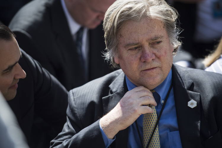 Steve Bannon, feeling the heat, waits for Trump to speak at a White House event. (Photo by Jabin Botsford/The Washington Post)</p>