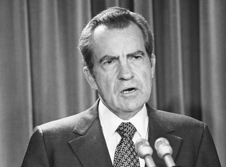Richard Nixon downplays the &ldquo;Saturday night massacre" in remarks at the White House. (Henry Burroughs/AP)</p>  