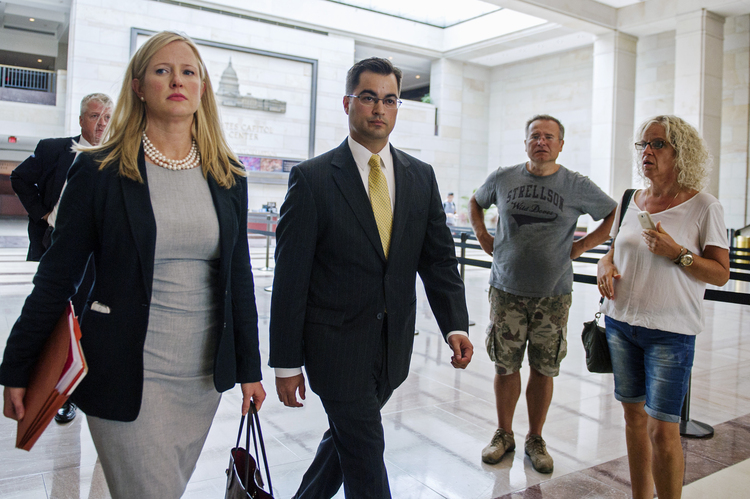 Bryan Pagliano, center, a former State Department employee who helped set up and maintain a private email server used by Hillary Clinton, is trying toi invoke the Fifth in a civil suit.&nbsp;(AP Photo/Cliff Owen, Lee)</p>  