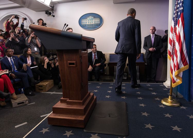 Barack Obama walks away at the end of his final press conference at the White House. (Nicholas Kamm/AFP/Getty Images)</p>  