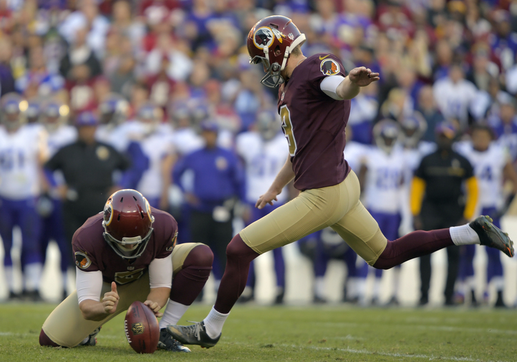 Dustin Hopkins kicks his second field goal in the fourth quarter at FedEx Field. (John McDonnell/The Washington Post)</p>  