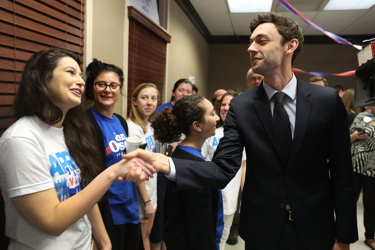 Democratic candidate Jon Ossoff greets volunteers in Atlanta. (Joe Raedle/Getty Images)</p>  