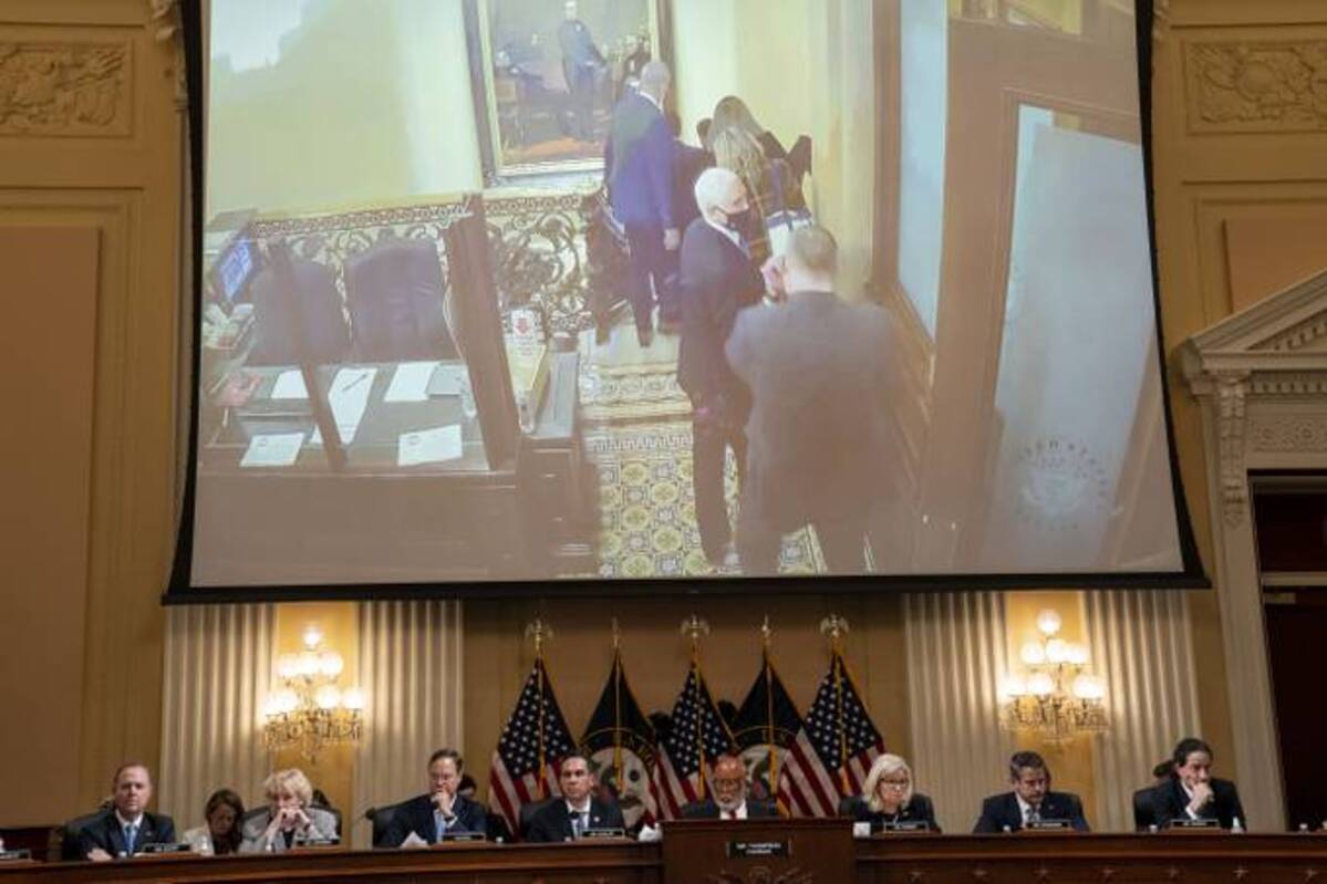 Frame grabs of former vice president Mike Pence at the U.S. Capitol during the Jan. 6, 2021, insurrection are seen on a video screen behind the House committee investigating the attack on the Capitol at a June 16 hearing. (Michael Robinson Chavez/The Washington Post)