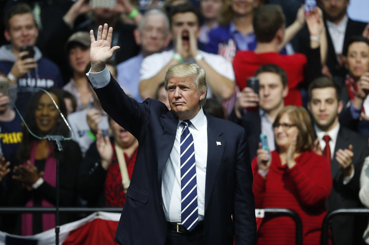 Donald Trump acknowledges supporters during his thank-you rally in Michigan last month. (Paul Sancya/AP)</p>  