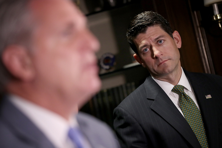 Paul Ryan listens as Kevin McCarthy answers questions during a press conference.&nbsp;(Win McNamee/Getty)</p>  