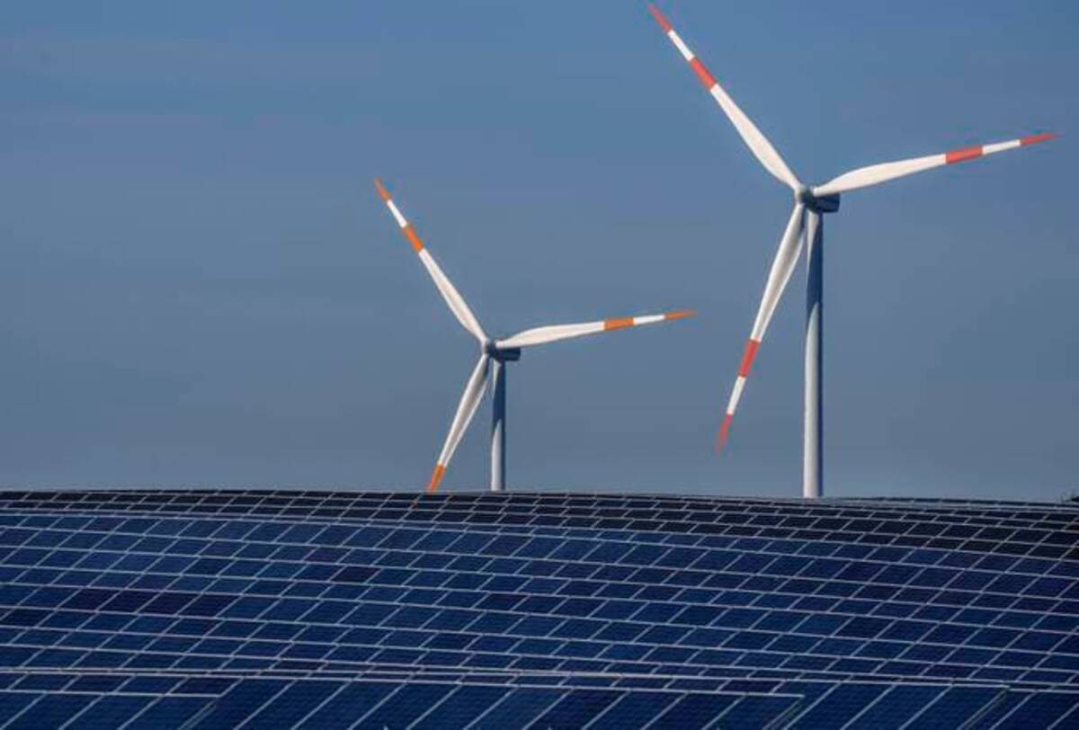 Wind turbines near a solar farm in Rapshagen, Germany. (Michael Sohn/AP)