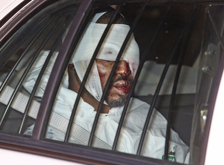 Markeith Loyd is transported from the Orlando Police headquarters after being captured last night. He eluded a massive manhunt for more than a week. (Red Huber/Orlando Sentinel via AP)</p>