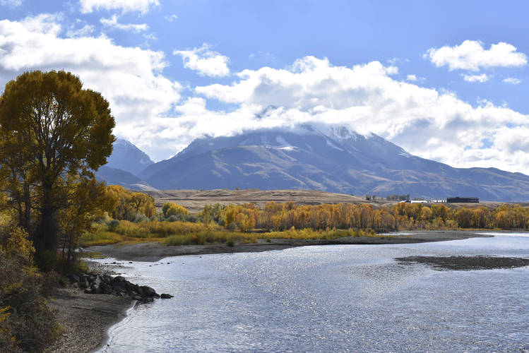Emigrant Peak is seen rising above the Paradise Valley and the Yellowstone River near Emigrant, Mont. (Matthew Brown/AP)  