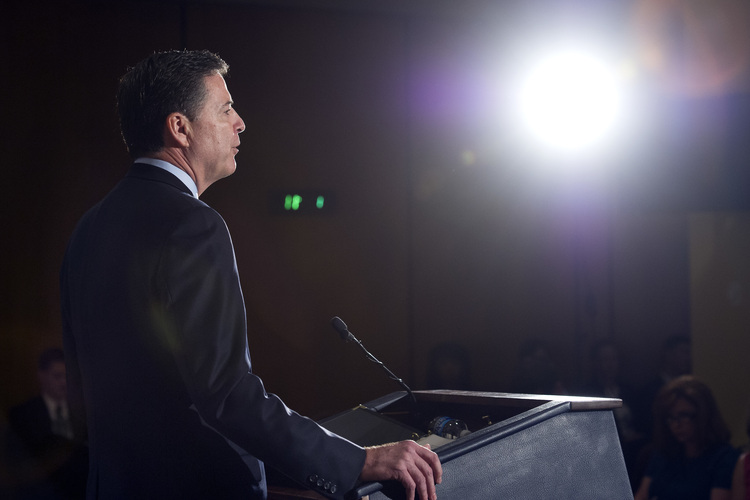James Comey makes a statement at FBI Headquarters. (Cliff Owen/AP)</p>  