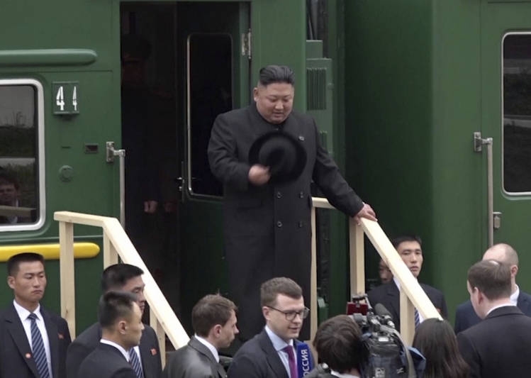 North Korean leader Kim Jong Un gets off a train at the Khasan station in the Primorye region of Russia on Wednesday for his summit with Vladimir Putin. (Primorsky Regional Administration Press Service/AP)  