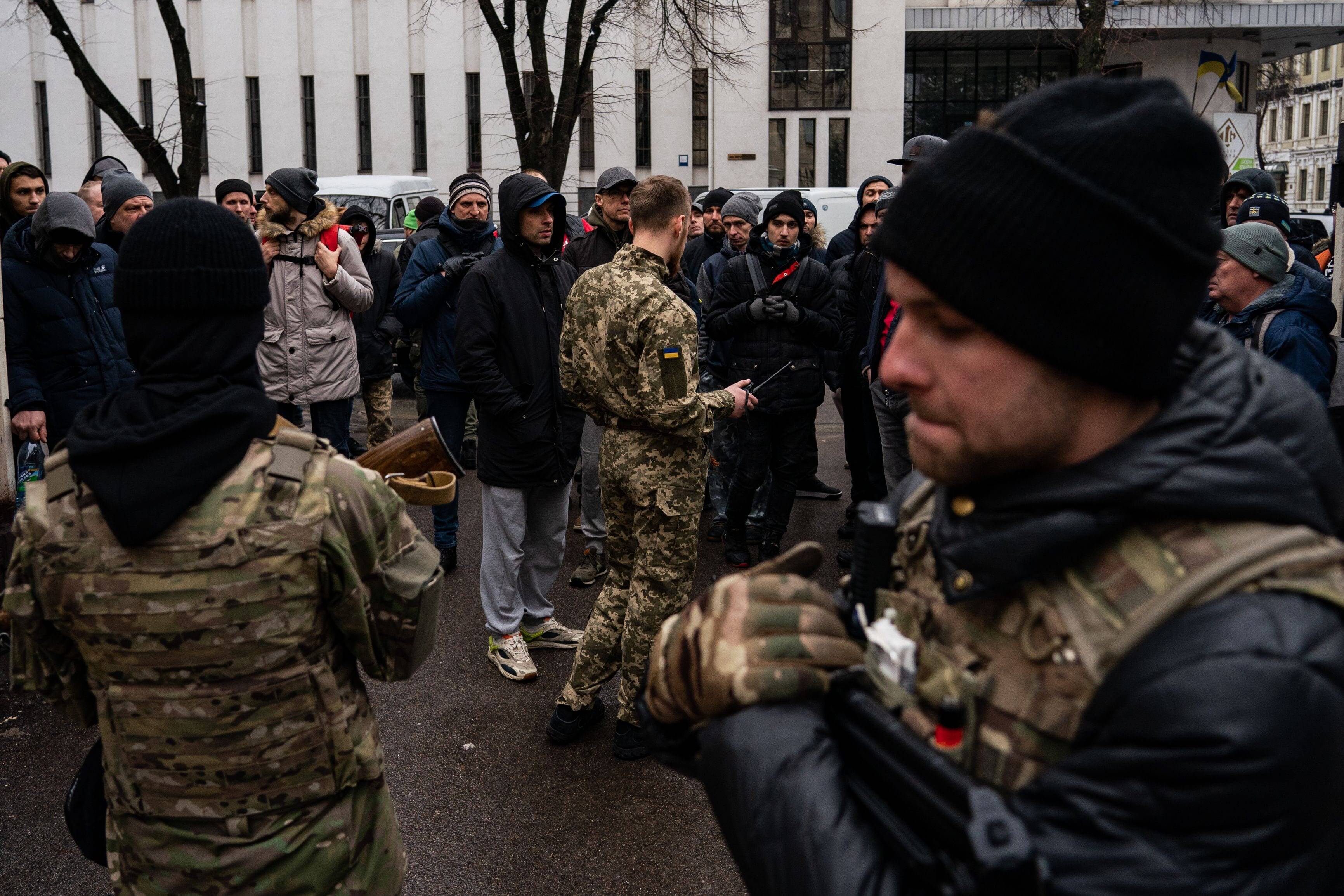 Ukrainians stand in line to join the Territorial Defense Forces in Kharkiv, Ukraine on Feb. 26. (Salwan Georges/The Washington Post)