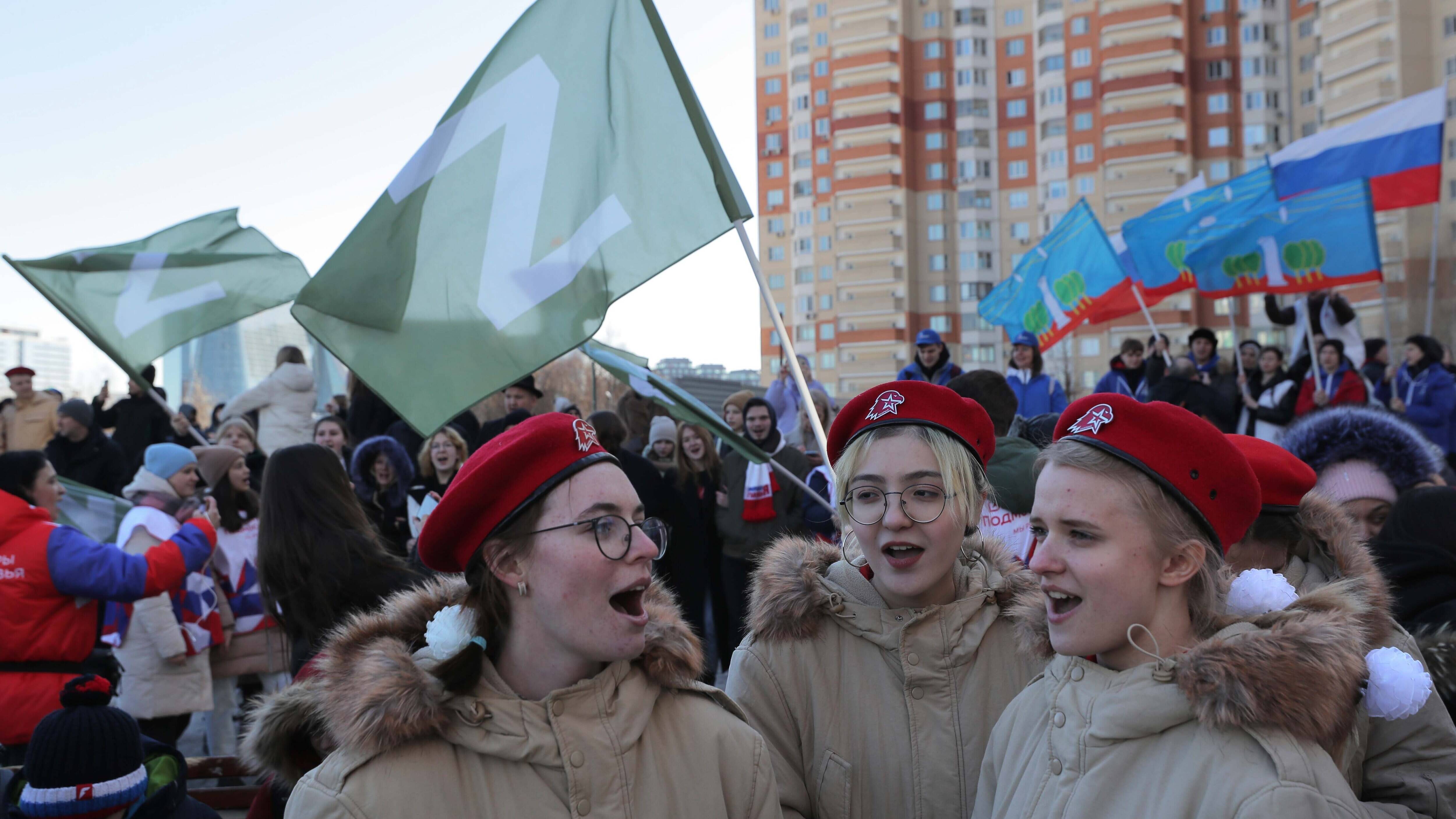 People wave flags with the letter Z during a rally in Krasnogorsk, Russia, in support of Russian Armed Forces organized to mark the eighth anniversary of the annexation of Crimea by Russia on March 18. (Maxim Shipenkov/EPA-EFE/Shutterstock)