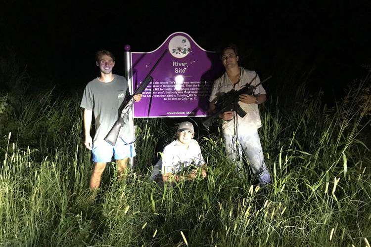 Three students from the University of Mississippi pose in front of a historical marker at the site where Emmett Till's body was found. (Instagram/Mississippi Center for Investigative Reporting)  
