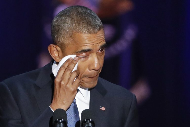 Obama wipes a tear from his eye on Tuesday night. (Kamil&nbsp;Krzaczymski/EPA)</p>  