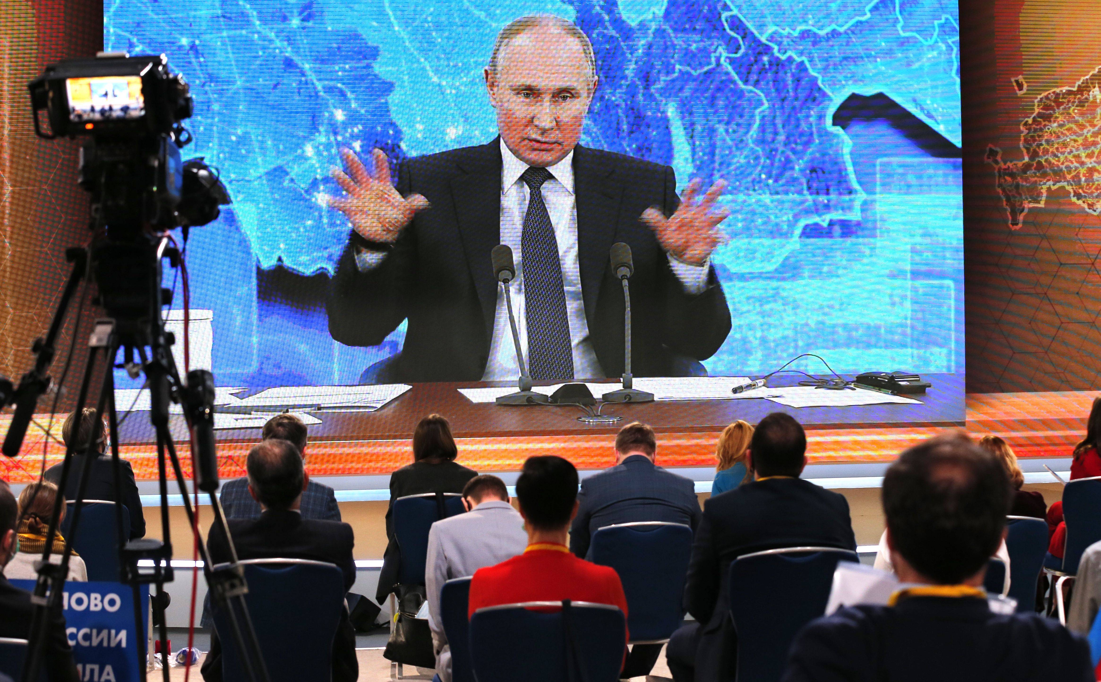 Russian President Vladimir Putin appears virtually for his annual news conference in Moscow on Thursday. (Alexander Zemlianichenko/AP)