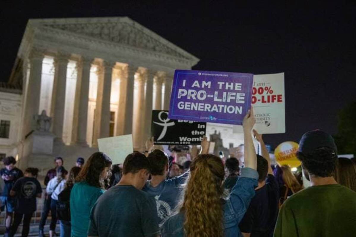 Pro-choice and anti-abortion protesters gather in front of the Supreme Court Monday night after news broke that Roe v. Wade is set to be overturned. (Amanda Andrade-Rhoades/For The Washington Post)