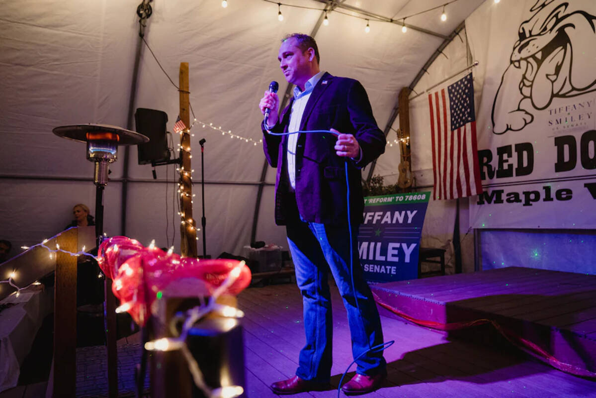 Matt Larkin, a Republican running against Rep. Kim Schrier to represent Washington's 8th Congressional District, addresses supporters at a campaign event at Red Dog Saloon in Maple Valley, Wash., last week. (Jovelle Tamayo/The Washington Post)