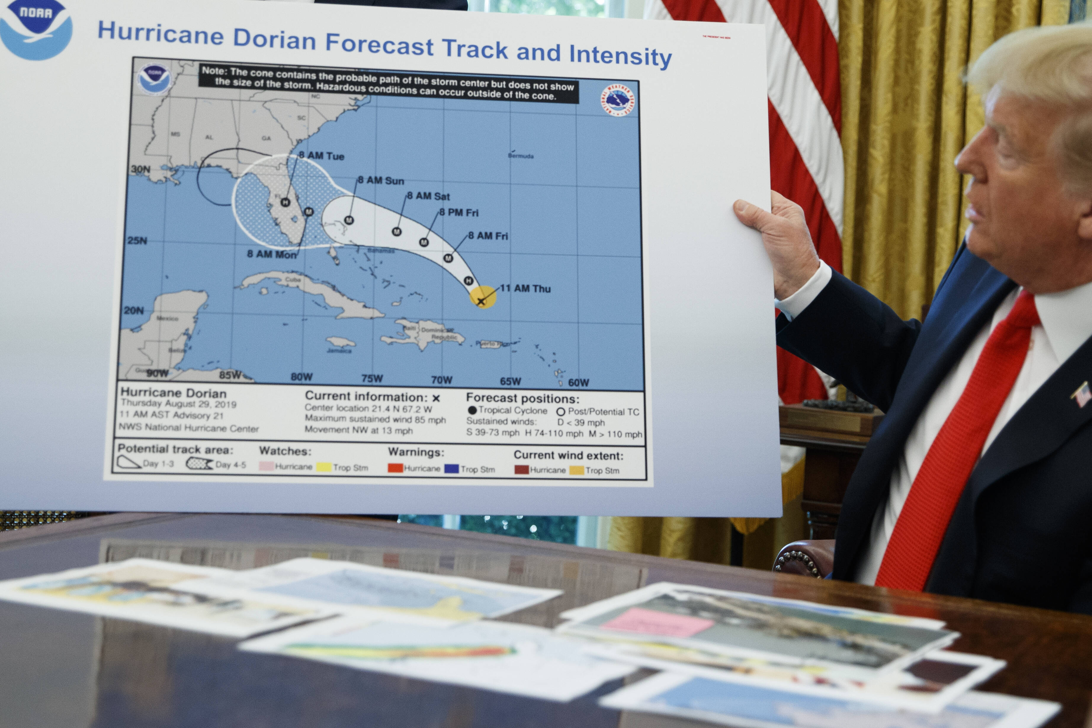 Trump holds a doctored image of Hurricane Dorian's path in 2019. (AP Photo/Evan Vucci)