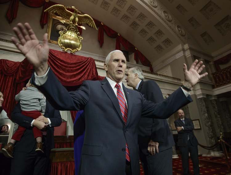 Mike Pence attends a swearing-in ceremony at the Capitol yesterday for Luther Strange, who was appointed to replace Attorney General Jeff Sessions as Alabama's senator. (J. Scott Applewhite/AP)</p>