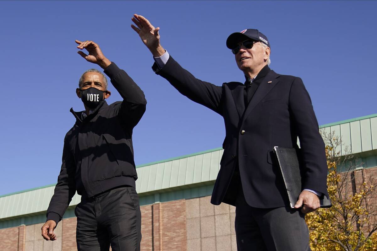 Barack Obama campaigns with Joe Biden in Flint, Mich., in late October 2020. (Andrew Harnik/AP)