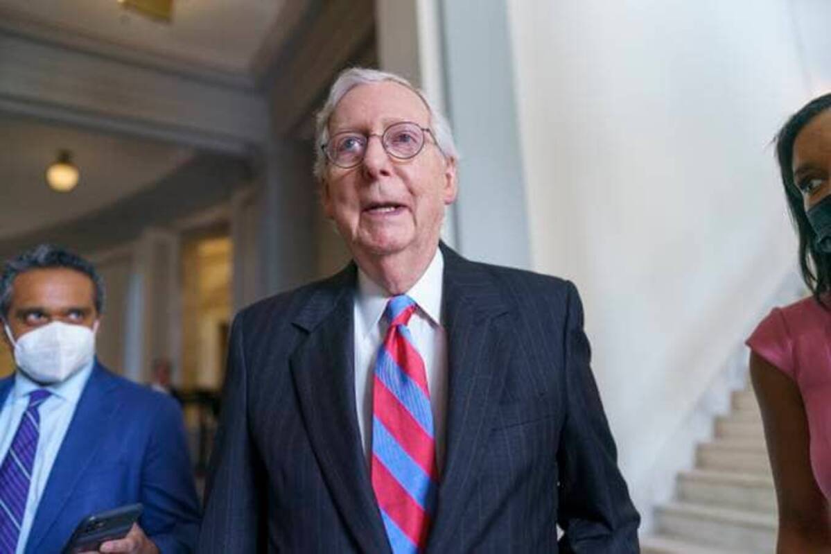 Senate Minority Leader Mitch McConnell (R-Ky.), is flanked by reporters as he returns to the Senate chamber for a vote after attending a bipartisan barbeque luncheon last Thursday. He has said he will block raising the debt ceiling. (AP Photo/J. Scott Applewhite)