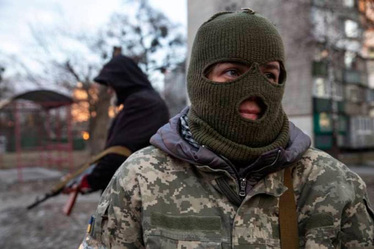 A member of Ukraine's Territorial Defense unit guarding a neighborhood in Kyiv, Ukraine on Monday. (Photo by Heidi Levine for The Washington Post)