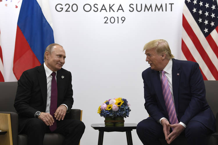 President Trump jokes with Putin on the sidelines of the G-20 summit in Osaka, Japan, on June 28. (Susan Walsh/AP)  