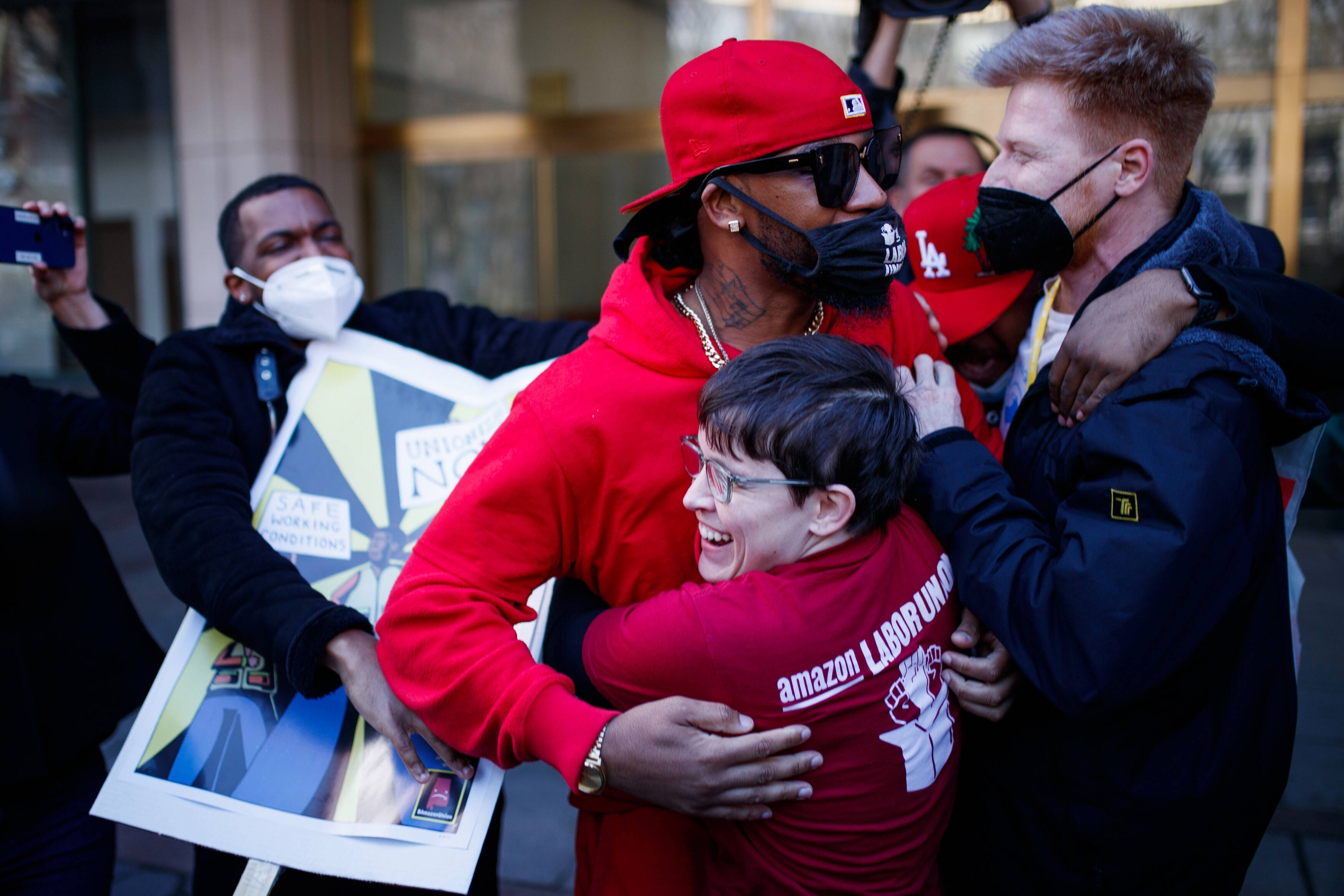 Union organizer Chris Smalls, in baseball cap, and others celebrate on Staten Island last week. (Eduardo Munoz Alvarez/AP) (Eduardo Munoz Avarez/AP)