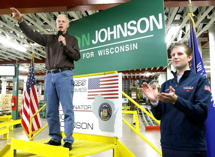 Ron Johnson, left, and Eric Trump, right, campaigned together in Eau Claire. (Dan Reiland/The Eau Claire Leader-Telegram via AP)</p>  