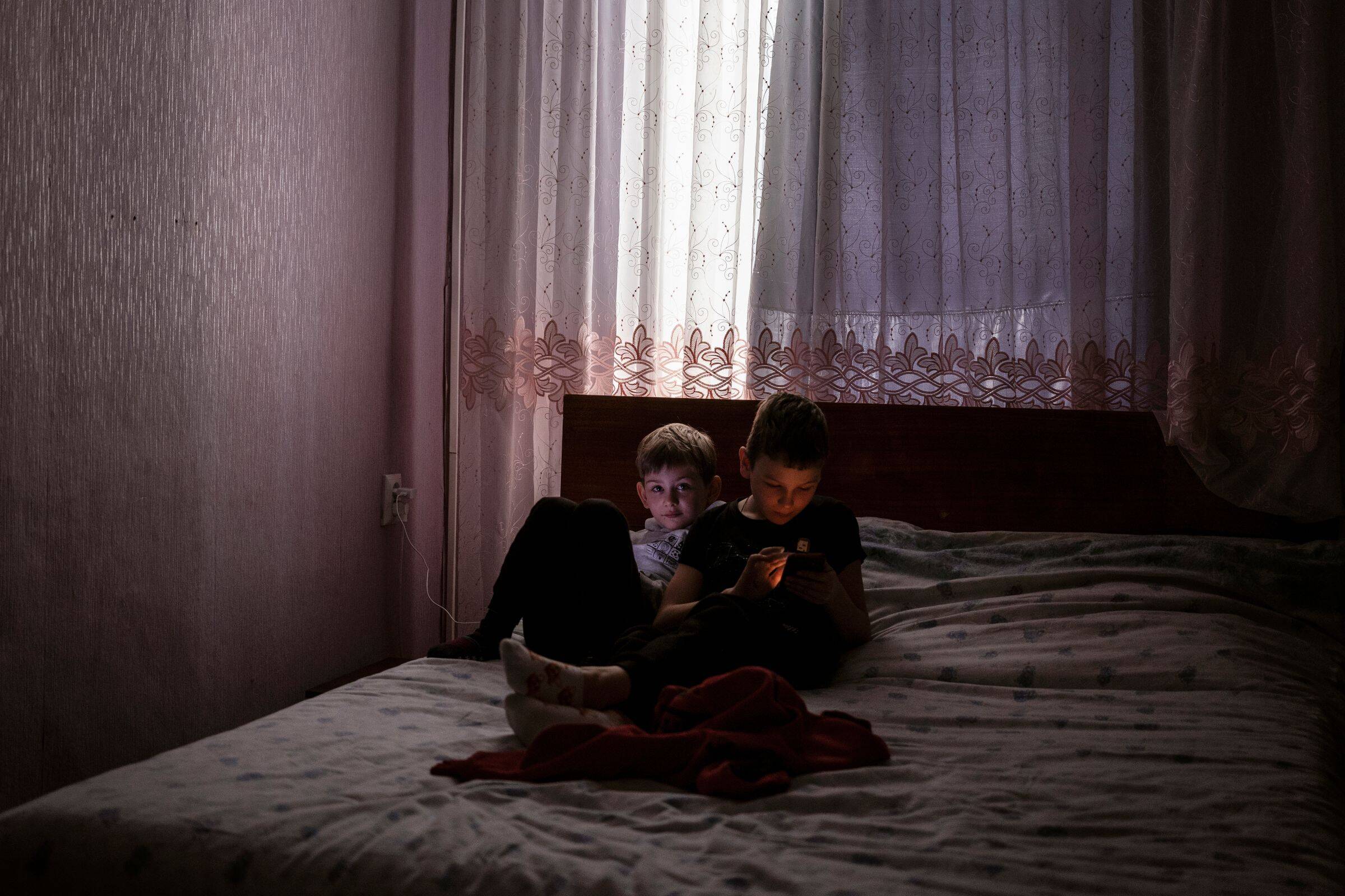 Demian and Roman spend their first night as refugees at a home in Moldova on March 3. (Gianmarco Maraviglia for The Washington Post)