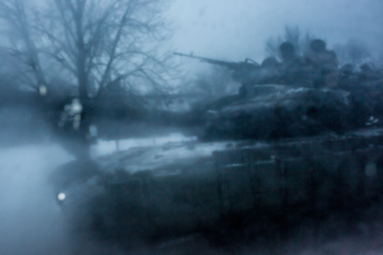 A Ukrainian tank heads away from the embattled town of Avdiivka. The conflict with Russia-backed rebels has intensified dramatically since the start of the month, leaving the town without water or electricity. (Brendan Hoffman/Getty Images)</p>  