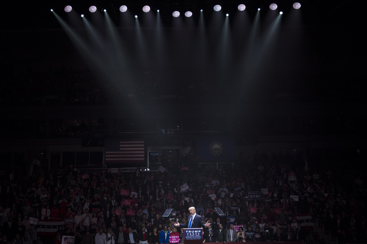 There was a laser show at SNHU Arena as Trump came on stage in Manchester last night. (Jabin Botsford/The Washington Post)</p>  