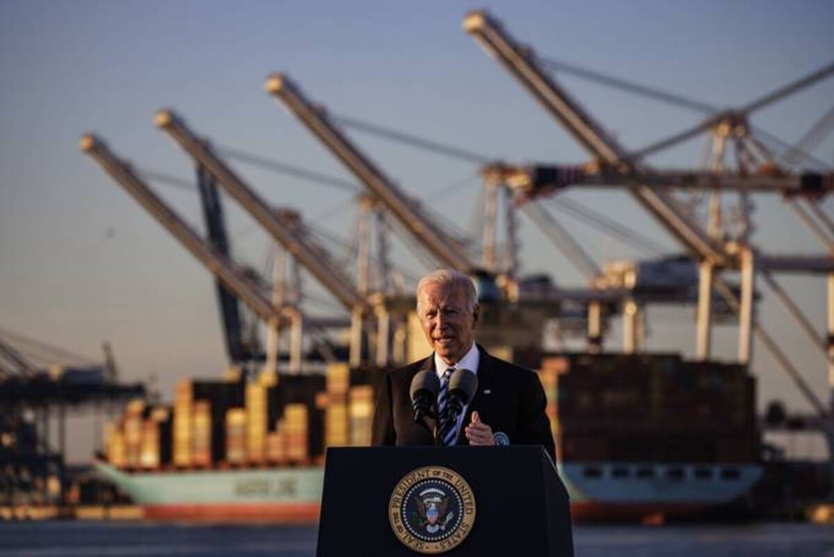 President Biden speaks on the bipartisan infrastructure deal at the Port of Baltimore on Wednesday. (Samuel Corum/Bloomberg)