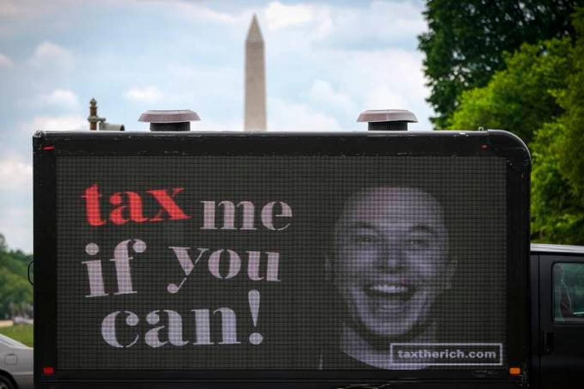 A mobile billboard calling for higher taxes on the ultrawealthy depicts an image of billionaire businessman Elon Musk, near the U.S. Capitol. (Drew Angerer/Getty Images)