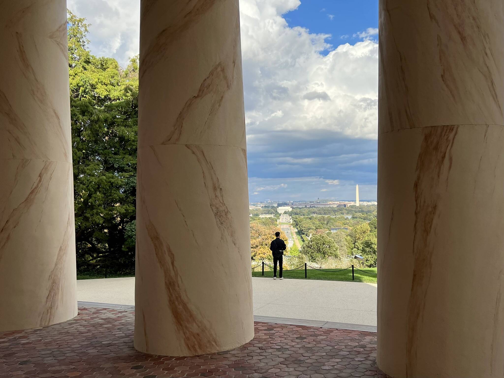 Sun and clouds on Saturday looking over the District from the porch of Arlington House in Arlington Cemetery (Brian Moulton via www.CWG.news/Photos Flickr page)