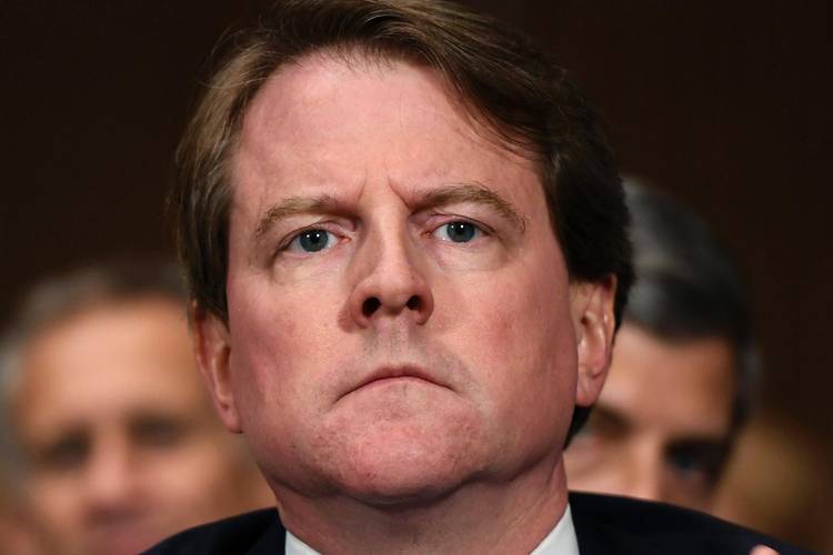 White House counsel Don McGahn listens as Brett Kavanaugh testifies before the Senate last September. (Saul Loeb/Pool/AP)  