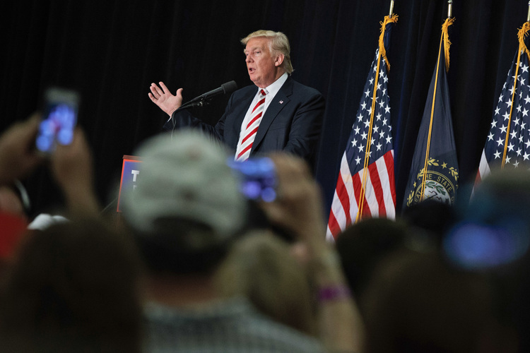 Trump speaks at Windham High School in New Hampshire on&nbsp;Saturday night.&nbsp;(Evan Vucci/AP)</p>  