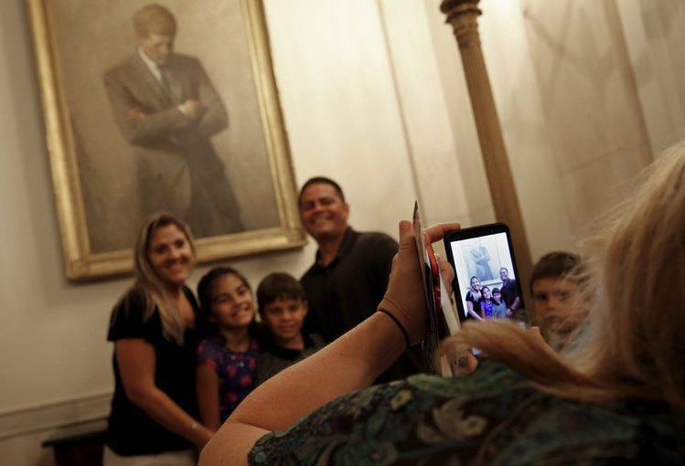 Visitors take photos during a tour of the White House in 2015 after Michelle Obama lifted a 40-year-old ban on taking photos during public tours of the executive mansion. (Jonathan Ernst/Reuters)</p>