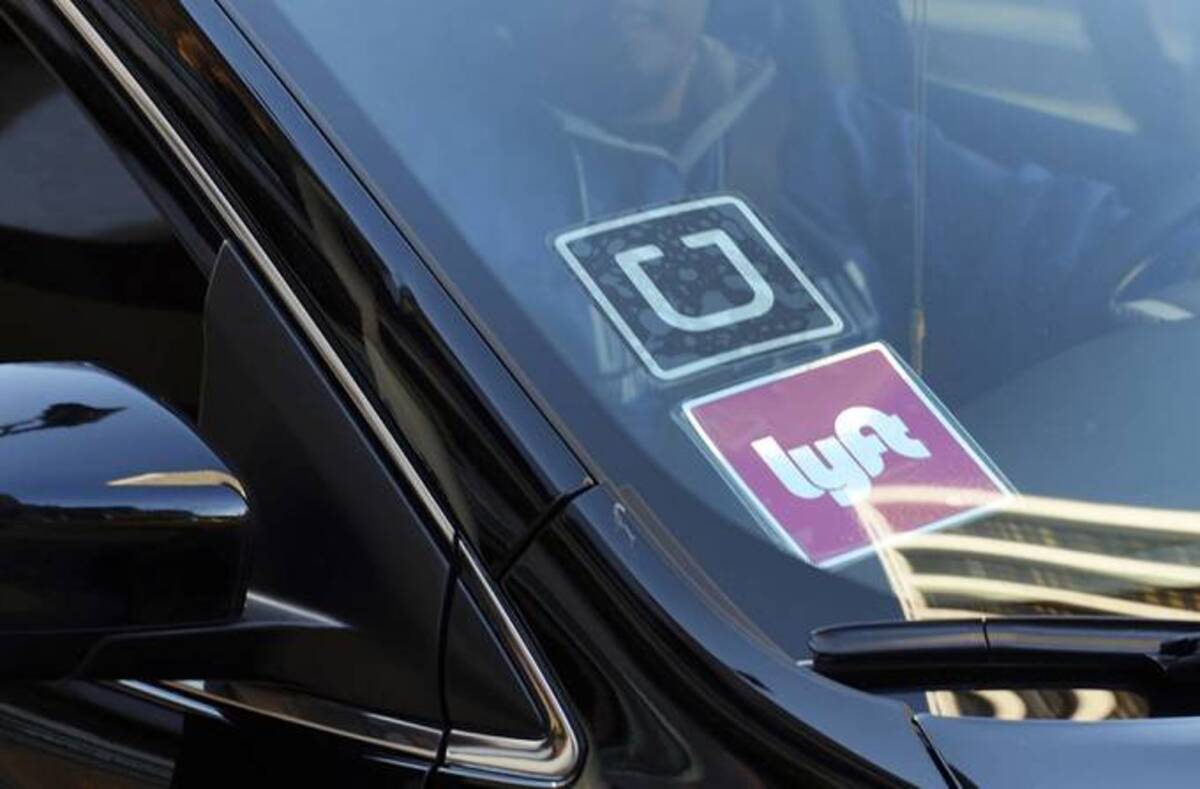 The drivers say they should be able to offer prices lower than the apps make consumers pay. (Richard Vogel/AP)