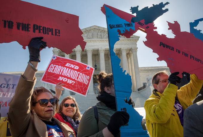 Demonstrators protest against gerrymandering at a rally at the Supreme Court. (Evelyn Hockstein for The Washington Post)