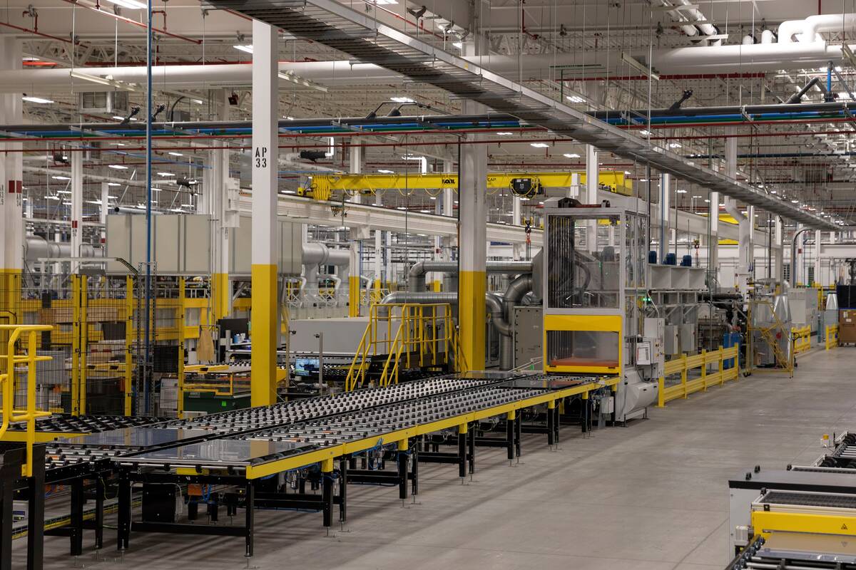 Panels on a conveyor belt last year at the First Solar manufacturing facility in Walbridge, Ohio. (Elaine Cromie for The Washington Post)