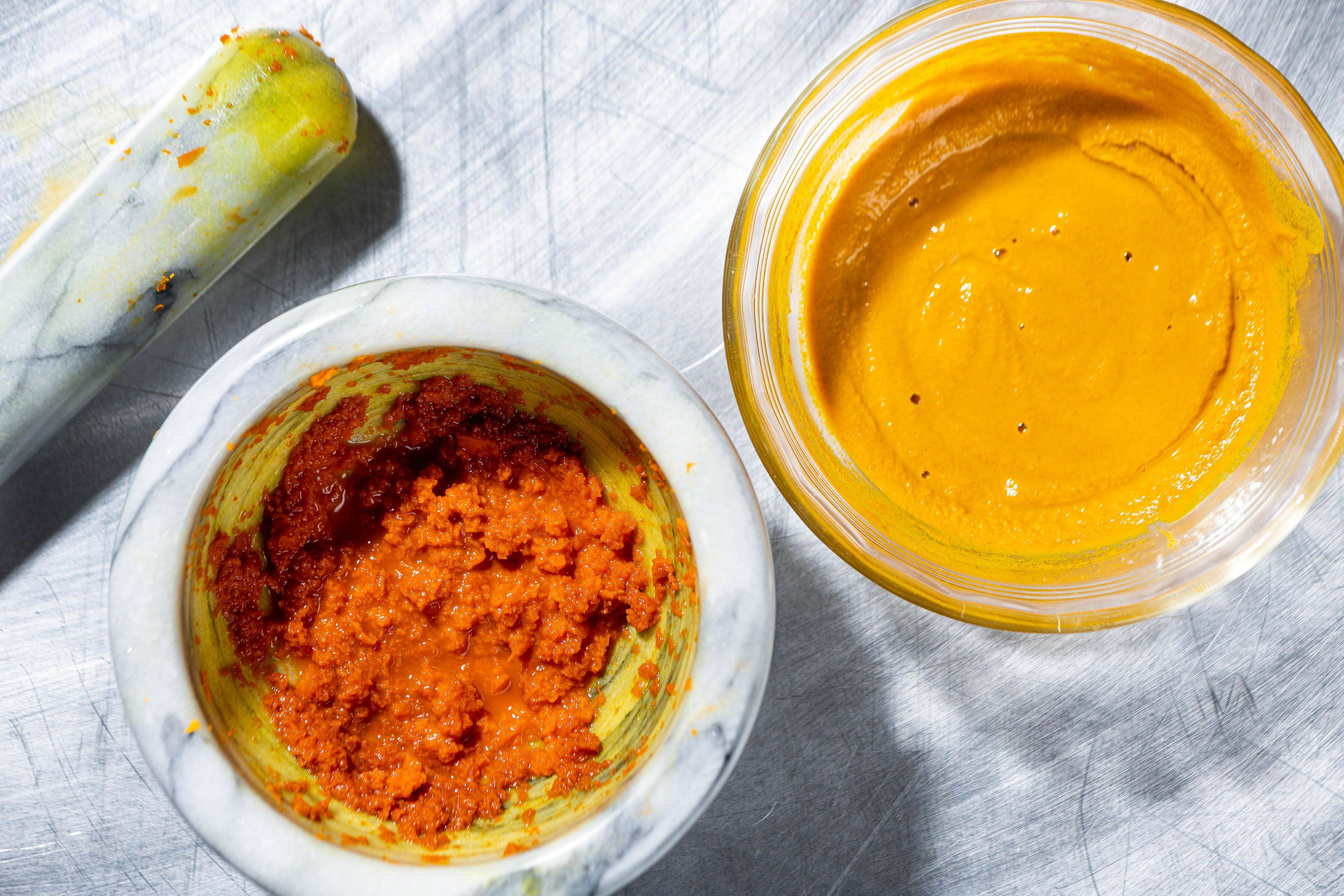 Left: Paste made from pounded fresh turmeric; Right: Paste made from ground turmeric. (Photos by Rey Lopez for The Washington Post; food styling by Lisa Cherkasky for The Washington Post)