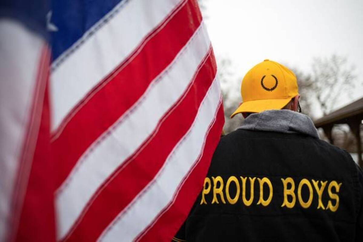 An anti-fascist researcher's Twitter account was suspended after someone reported a photo involving the Proud Boys, a far-right group with a history of violence. Twitter said the move was a mistake. (Reuters/Emily Elconin)