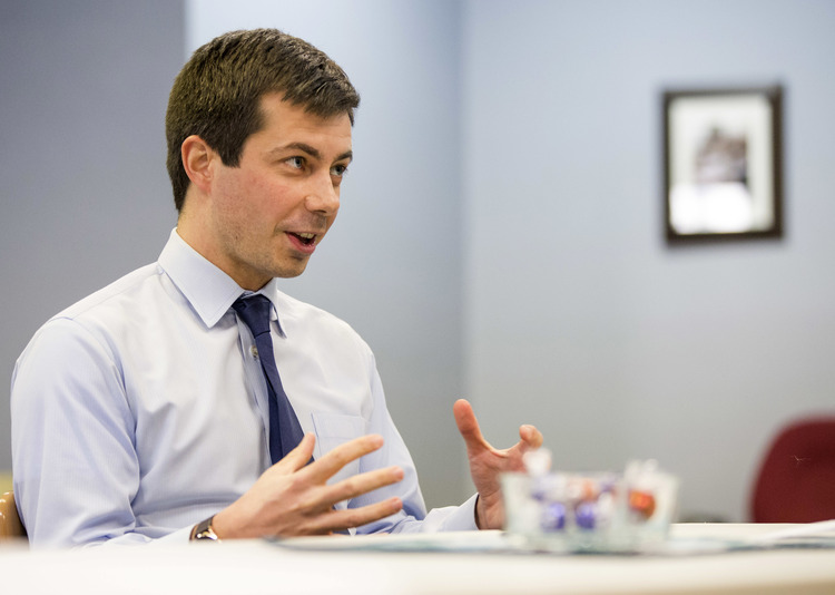 Pete Buttigieg talks to a reporter in his office on Wednesday. (Robert Franklin/South Bend Tribune via AP)</p>